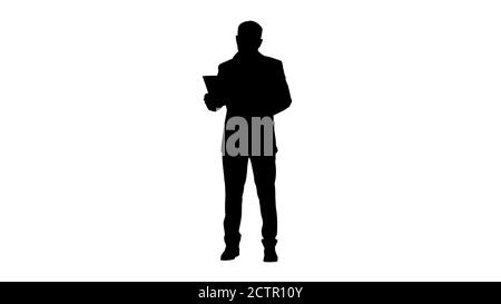 Homme d'affaires debout et lisant les papiers sérieusement, Alpha Channel Banque D'Images