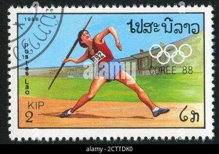 LAOS - VERS 1988 : timbre imprimé par le Laos, montre l'athlète, vers 1988. Banque D'Images