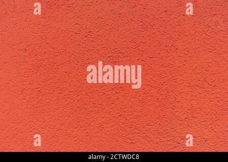 Texture de mur de ciment rouge avec rayures, arrière-plan Banque D'Images