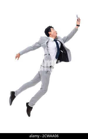 Prenez la course téléphonique sautez un homme d'affaires Banque D'Images