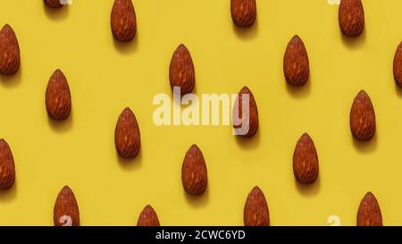 Des rangées d'amandes sur fond jaune - très bon été image Banque D'Images