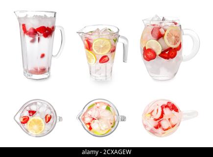 Limonade aux fraises fraîches en carafes sur fond blanc Banque D'Images