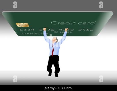 Un homme lutte pour tenir une carte de crédit géante qui représente la dette de carte de crédit. Banque D'Images