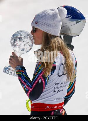 Lindsey Vonn of the U.S. kisses a trophy of the women's Super G discipline at the alpine ski World Cup finals in Schladming March 15, 2012.         REUTERS/Lisi Niesner (AUSTRIA  - Tags: SPORT SKIING)