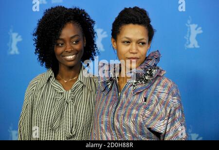Actresses Aissa Maiga (L) and Anisia Uzeyman attend a photocall to promote the movie 'Aujourd'hui - Tey' at the 62nd Berlinale International Film Festival in Berlin February 10, 2012.  REUTERS/Morris Mac Matzen  (GERMANY - Tags: ENTERTAINMENT)