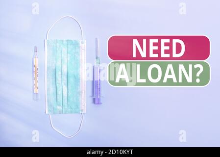 Écriture de texte écriture de texte besoin D'UNE Loanquestion. Photo conceptuelle offrant un argent pour un individual ou des finances d'affaires première précaution médicale Banque D'Images