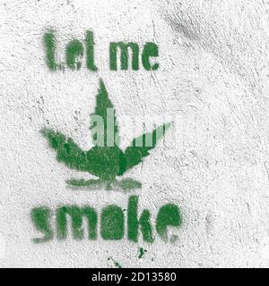 Symbole de feuille de marijuana sur le mur grundy avec message « moke » Banque D'Images