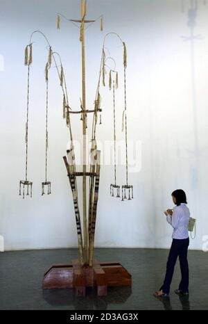 A Vietnamese Visitor To The Museum Of Ethnology In Hanoi April 21 01 Looks At A Ritual Mast For The Buffalo Sacrifice Of The Giarai Ethnic Minority Of The Central Highlands Of Vietnam Over The Past Years People Of Both Vietnamese And Ethnic Minority Groups