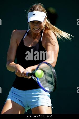 Russia's Wimbledon champion Maria Sharapova returns a ball during her practice session for the Hansol Korea Open Tennis Championships in Seoul September 29, 2004. Sharapova will play her second round match on Thursday. REUTERS/Kim Kyung-Hoon  KKH/CP