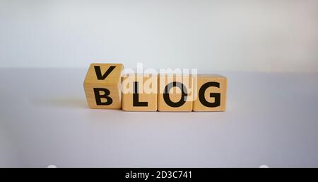 Blog ou Vlog. Transformé un cube et changé l'expression 'BLOG' en 'VLOG' ou vice versa. Magnifique fond blanc. Concept d'entreprise et d'information. C Banque D'Images