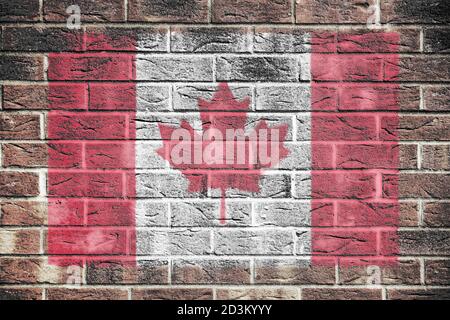 Drapeau du Canada sur fond de mur de briques Banque D'Images