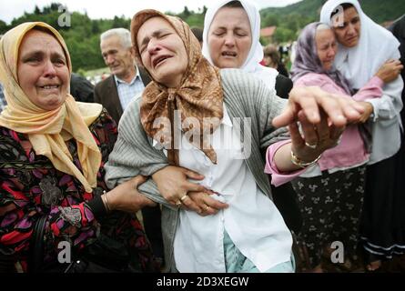 Bosnian Muslim Women Cry As Their Relative Is Buried In Potocari July 11 2005 Relatives Wept