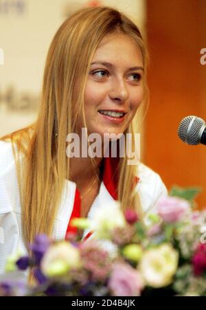 Russia's Wimbledon champion Maria Sharapova smiles during a news conference in Seoul September 29, 2004. Sharapova will play her second round match of the Hansol Korea Open Tennis Championshipson on Thursday. REUTERS/Kim Kyung-Hoon  KKH