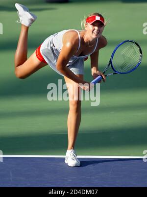Russia's Wimbledon champion Maria Sharapova serves against U.S. Open champion compatriot Svetlana Kuznetsova during their semi-final match at the China Open tennis tournament in Beijing September 25, 2004. Kuznetsova won 6-2 6-2. REUTERS/Andrew Wong  ASW