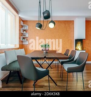 Salle à manger moderne de style italien avec petite cheminée avec murs en plâtre orange, maquette, rendu 3d, illustration 3d Banque D'Images