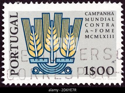 PORTUGAL - VERS 1963: Un timbre imprimé au Portugal du numéro "liberté contre la faim" montre l'emblème de la campagne, vers 1963. Banque D'Images