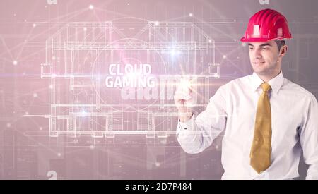 Beau architecte avec un casque dessin NUAGE inscription JEU, nouveau concept de technologie