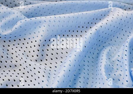 Bleu mesh sport porter tissu motif textile arrière-plan. Couleur bleue maillot de football vêtements tissu texture sport vêtements. Porifère poreux respirable m Banque D'Images