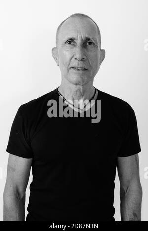 Studio shot of bald man against white background Banque D'Images