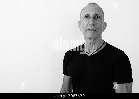 Studio shot of bald man against white background Banque D'Images