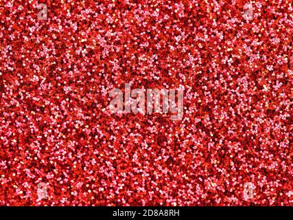 Glitter et éclat. Fête brillant fond rouge. Texture abstrait Banque D'Images