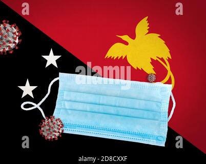 Illustration conceptuelle du masque chirurgical sur le drapeau de la Papouasie-Nouvelle-Guinée et du coronavirus ou des particules Covid-19 à l'avant. Banque D'Images