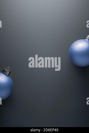 Fond gris ombré avec deux boules de Noël rondes bleu clair sur les côtés. Décoration de Noël, concept d'atmosphère festive. Copier l'espace. Banque D'Images