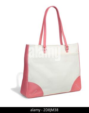 Sac à main en toile rose et blanc avec boucles argentées photographiées un arrière-plan blanc Banque D'Images