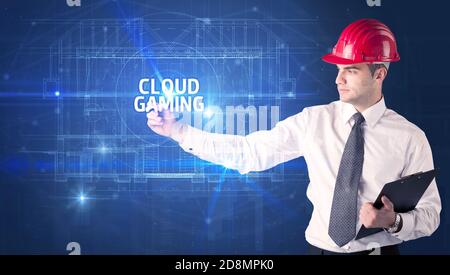 Beau architecte avec un casque dessin NUAGE inscription JEU, nouveau concept de technologie
