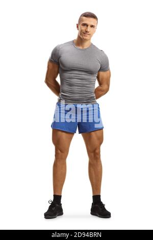 Photo pleine longueur d'un jeune homme musclé vêtements de sport isolés sur fond blanc Banque D'Images