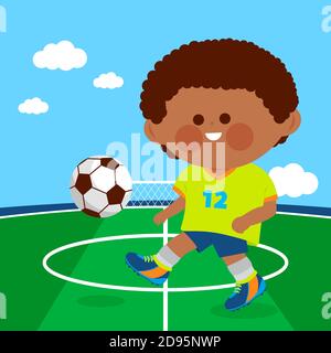 Petit garçon jouant au football dans le terrain de football. Banque D'Images