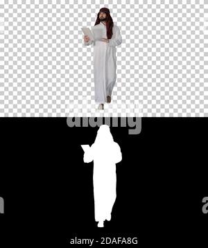 Sheikh utilisant la tablette numérique et la marche, Alpha Channel avec SILH Banque D'Images