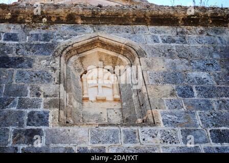 Croix byzantine de la haute église sur le mur, église abandonnée à Kayakoy (Karmylassos) du XVIIe siècle, Fethiye, Turquie Banque D'Images