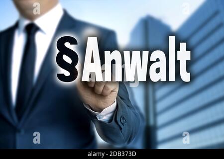 Anwalt (in german Lawyer) touchscreen is operated by businessman. Stock Photo