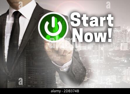 Start Now is shown by businessman concept. Stock Photo