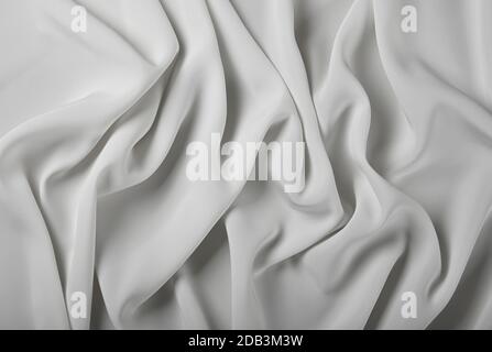 Gros plan textile abstrait arrière-plan de plis blancs pliés en tissu, vue de dessus surélevée, directement au-dessus Banque D'Images