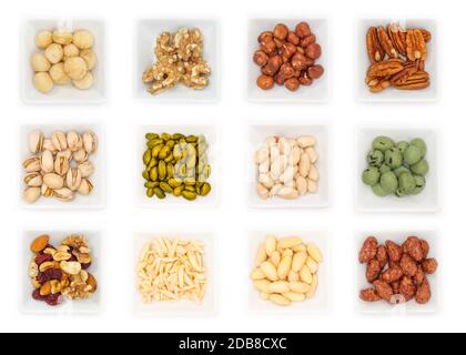 Différents types d'écrous en bols blanc en vue supérieure Banque D'Images