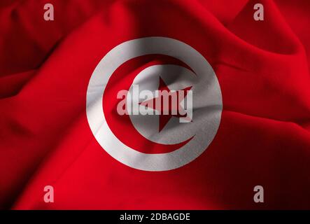 Gros plan du drapeau tunisien à volant, drapeau tunisien soufflant dans le vent Banque D'Images