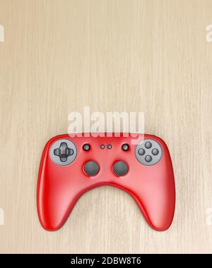 Manette de jeu sans fil rouge sur un bureau en bois, vue du dessus Banque D'Images
