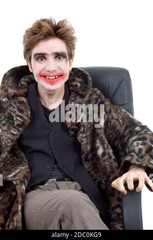 Jeune homme habillé comme joker, isolated on white Banque D'Images