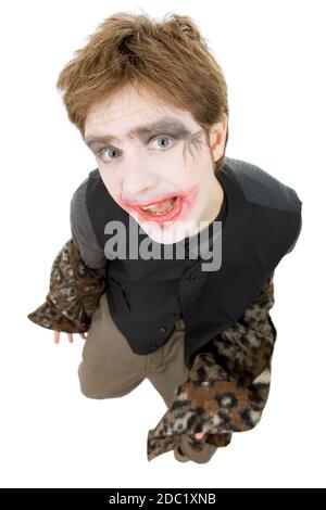 Jeune homme habillé comme joker, isolated on white Banque D'Images