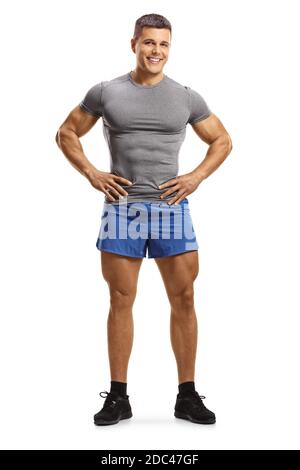 Portrait complet d'un jeune homme musclé en vêtements de sport isolé sur fond blanc Banque D'Images