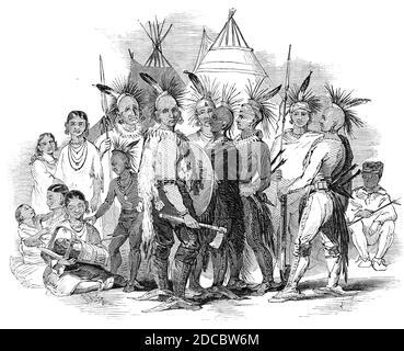 Iowa Indians, au Egyptian Hall, Piccadilly, 1844. Les natifs américains exposés à Londres : '...trois chefs, quatre « braves » ou guerriers, quatre squaws, un petit garçon et une fille, et un « papoose » ou un bébé.&#xa0;l'apparence de la fête dans leur costume romantique, armée de tomahawks et d'autres armes guerrières, est très pittoresque. Leurs robes sont recouvertes d'une profusion d'ornements brillants, et les têtes des mâles... sont shorn, à l'exception d'une crête de cheveux, à laquelle est fixée une plume de l'aile de l'aigle de guerre, et une variété de bijouterie indienne...'. Banque D'Images