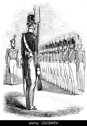 Cadets, dans les nouvelles nominations, 1844. Soldats à l'Académie militaire royale de Wooolwich, au sud-est de Londres: 'Gentleman Cadets, en costume militaire complet... chaque Cadet armé d'une belle et très finie carbine, pesant moins de deux livres et la moitié de ceux qui sont en cours d'approvisionnement au Royal Regiment of Artillery. Ces mousquets miniatures sont égaux, en apparence et en construction soignée, à la pièce de fanage la plus chère. De "Illustrated London News", 1844, vol I. Banque D'Images