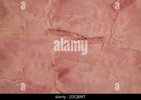 Texture du jambon - vue de dessus et gros plan de grandes tranches de jambon fumé cuit Banque D'Images