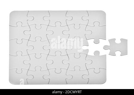 Fond blanc de motif de puzzle. Placement de la dernière pièce de puzzle Banque D'Images