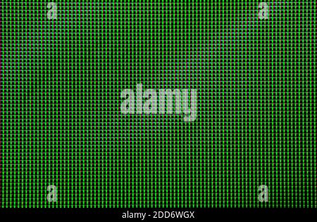 Pixels dans l'échelle macro de l'écran à cristaux liquides. Arrière-plan de la texture de l'écran mural vidéo. Vert avec quelques dégradés diagonaux Banque D'Images