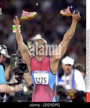 PAS DE FILM, PAS DE VIDÉO, PAS DE TV, PAS DE DOCUMENTAIRE - © JOE LEDFORD/KRT/ABACA. 20849-1. Sydney-Australie, 23/9/2000. Maurice Greene, aux États-Unis, a remporté ses chaussures de course à 100 m en 9.87 secondes aux Jeux Olympiques de Sydney en 2000. Banque D'Images