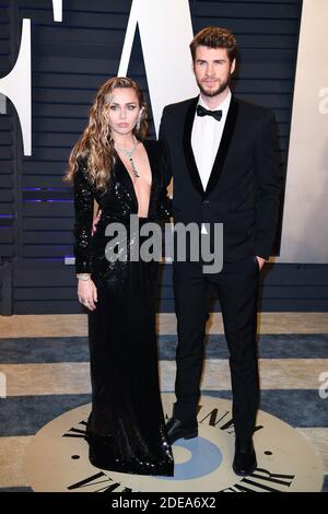 Miley Cyrus et Liam Hemsworth participant au Vanity Fair Oscar Party 2019 organisé par le rédacteur en chef Radhika Jones au Wallis Annenberg Center for the Performing Arts le 24 février 2019 à Los Angeles, CA, États-Unis. Photo de David Niviere/ABACAPRESS.COM Banque D'Images