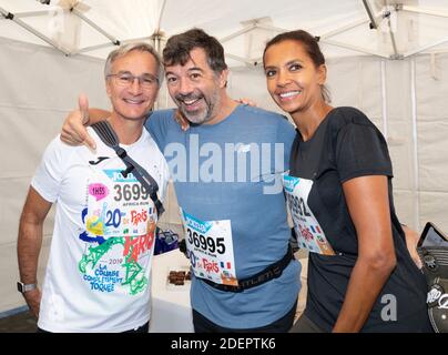 Laurent Petitguillaume, Stephane Plaza et Karine le Marchand au 20 kilomètres de Paris, une course sur route de 20 kilomètres qui commence au Pont d'Iena au pied de la Tour Eiffel à Paris, France, le 13 octobre 2019. Photo de Loic Baratoux/ABACAPRESS.COM Banque D'Images